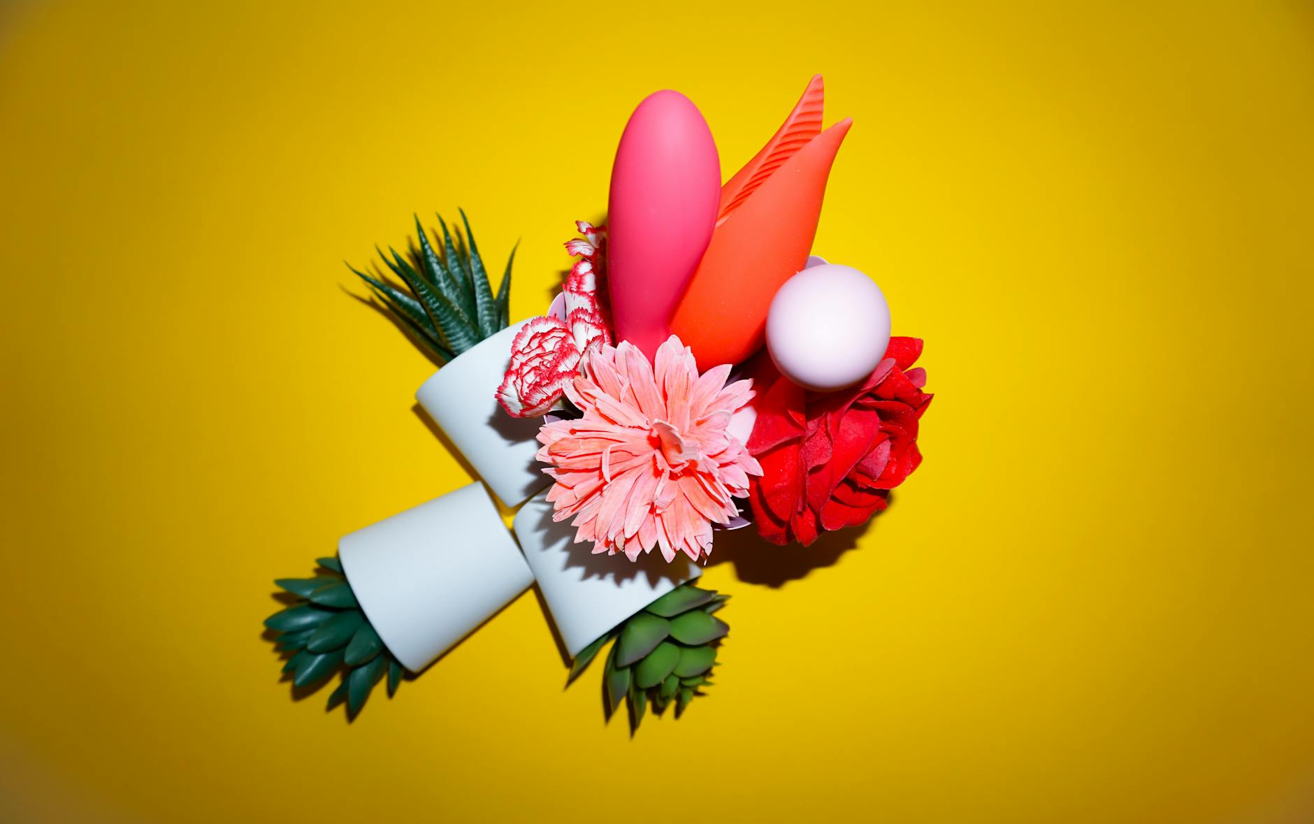Hand holding a lemon against a bright yellow background, conveying freshness and intentionality