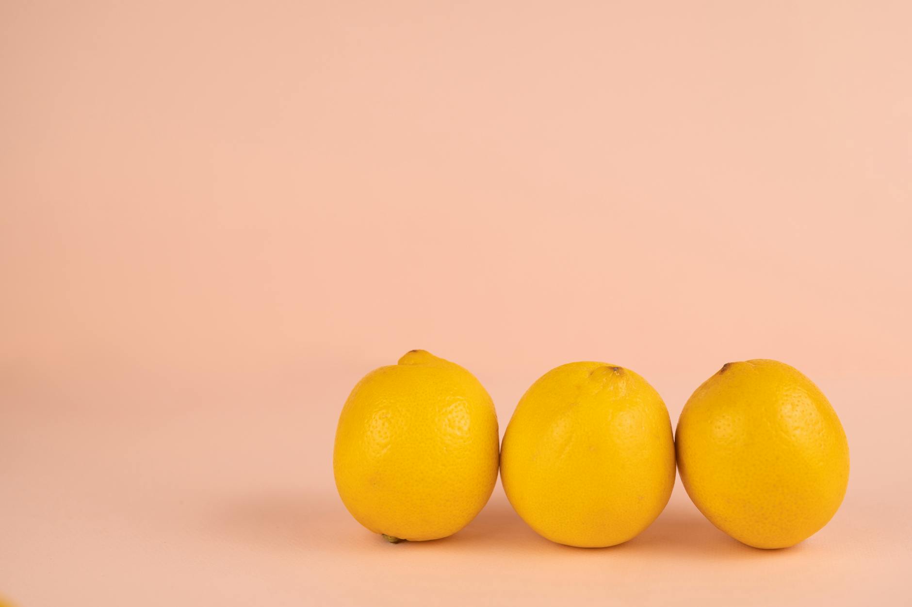 Vibrant collection of colorful clitoral vibrators and adult toys arranged on a bright yellow surface